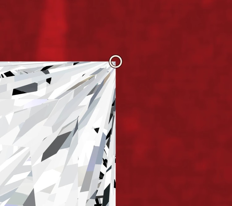 Close-up of a princess cut diamond, with its pointed corner circled, by Lily Dia Jewellery