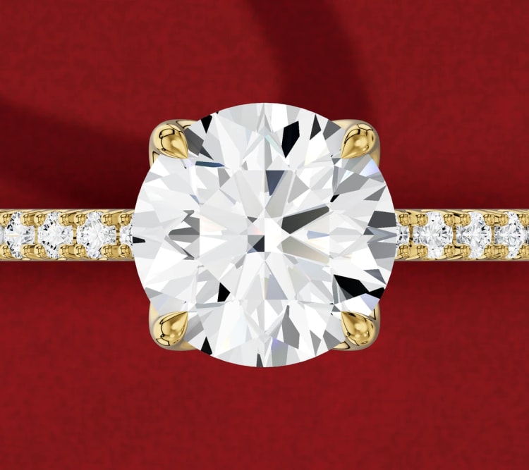 Tulip setting round diamond engagement ring with a pavé band, seen from above, by Lily Dia Jewellery