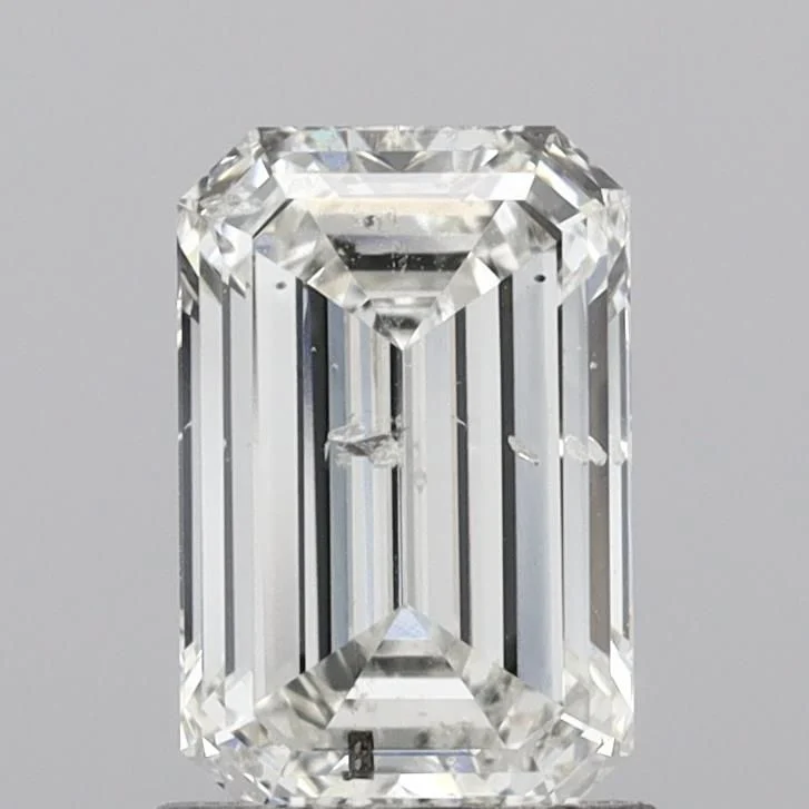 An emerald cut diamond with inclusions visible under the open table, showing why clarity is harder to hide in this shape, an emerald cut diamond shape education guide by Lily Dia Jewellery