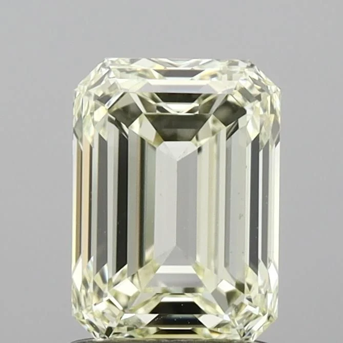 An emerald cut diamond with a warm, slightly yellow body colour, showing how readily an emerald cut reveals colour, an emerald cut diamond shape education guide by Lily Dia Jewellery