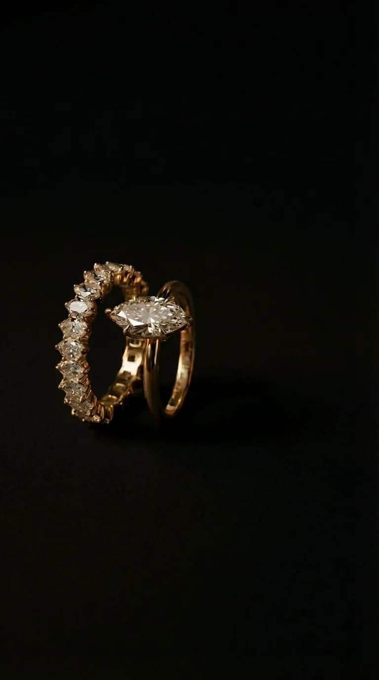 A marquise cut diamond solitaire engagement ring paired with a matching marquise diamond wedding band in yellow gold, a marquise cut diamond shape education guide by Lily Dia Jewellery