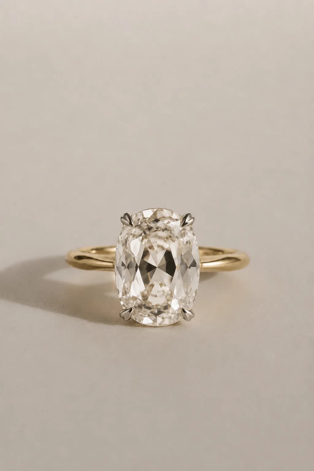 An elongated old mine cut diamond solitaire engagement ring in yellow gold, an old mine cut diamond shape education guide by Lily Dia Jewellery