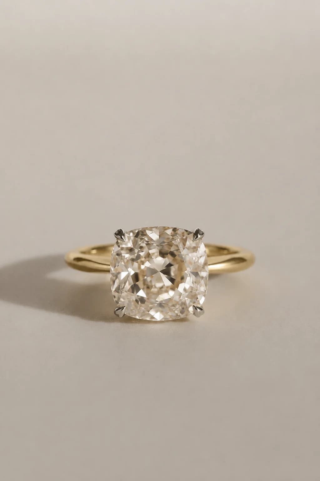 An old mine cut diamond solitaire engagement ring in yellow gold, an old mine cut diamond shape education guide by Lily Dia Jewellery