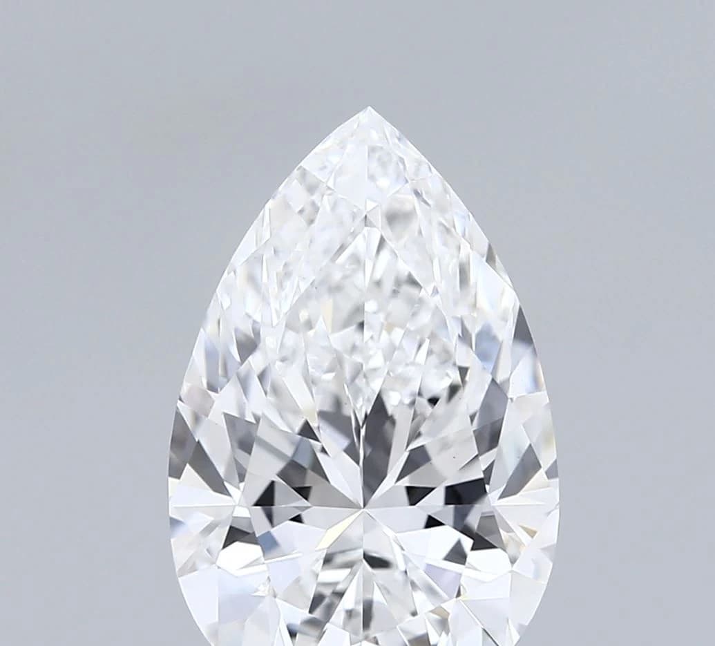 A loose pear shaped diamond shown from above, with one rounded end and one pointed tip forming a teardrop outline, a pear shaped diamond shape education guide by Lily Dia Jewellery