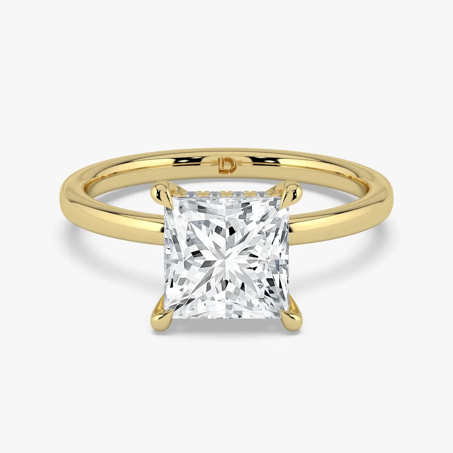 A princess cut diamond solitaire engagement ring with a hidden halo in yellow gold, a princess cut diamond shape education guide by Lily Dia Jewellery