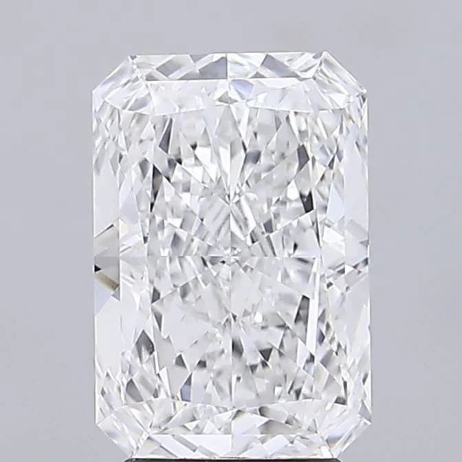 A loose radiant cut diamond shown from above, a brilliant-faceted stone with a rectangular outline and cropped corners, a radiant cut diamond shape education guide by Lily Dia Jewellery