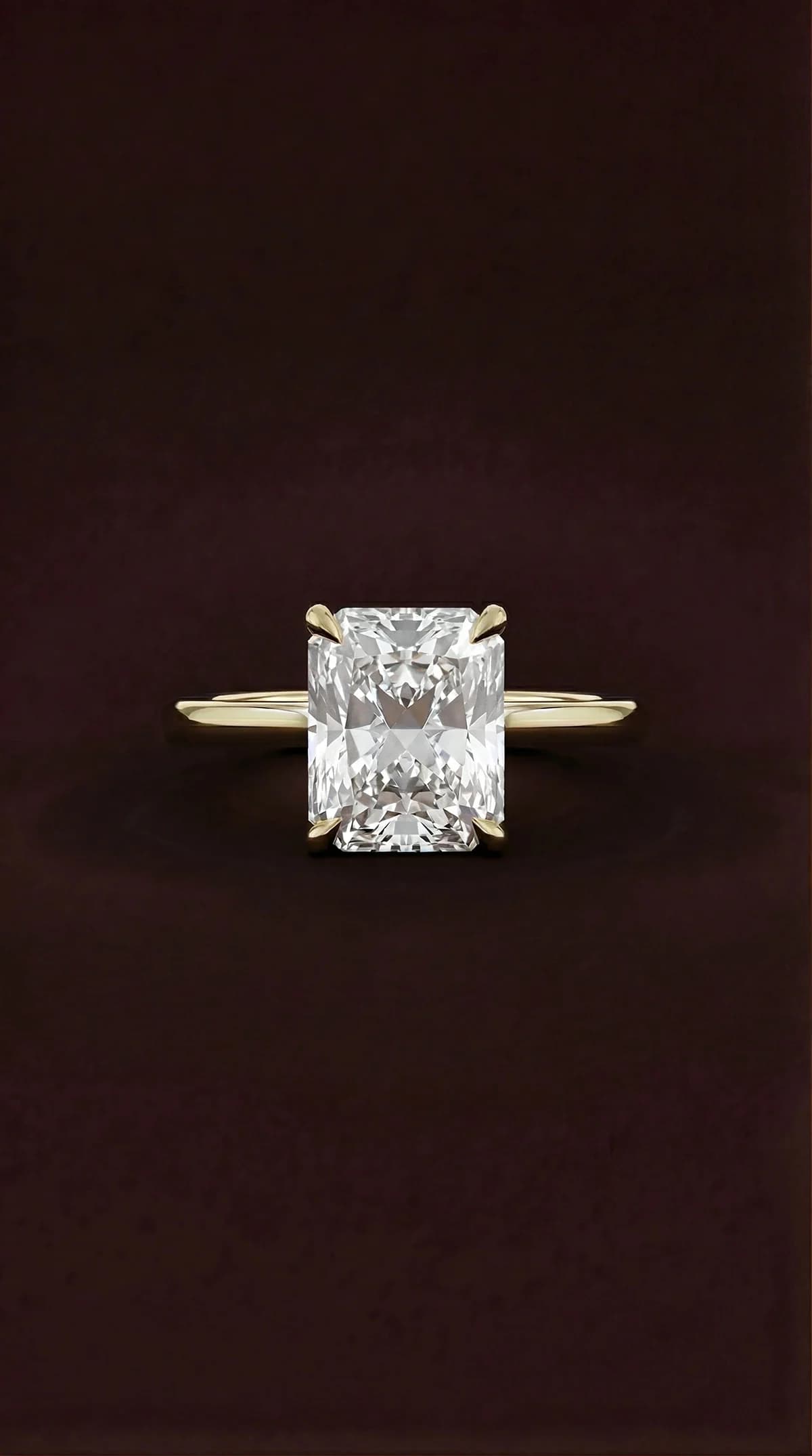 A radiant cut diamond solitaire engagement ring in yellow gold, a radiant cut diamond shape education guide by Lily Dia Jewellery