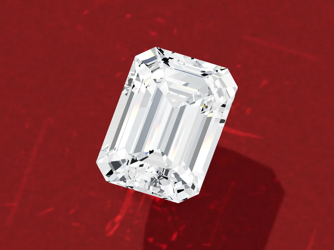 3D render of a loose emerald-cut diamond seen from above at an angle, with rows of step facets and trimmed corners.