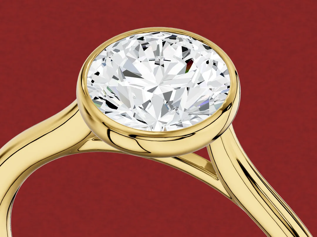 3D render close up of a round diamond held by a metal rim that runs all the way round it.