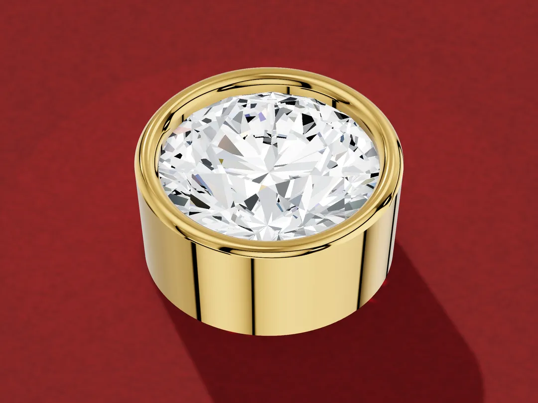 3D render of a round diamond held in a cylindrical yellow gold collar, shown on its own without a band.