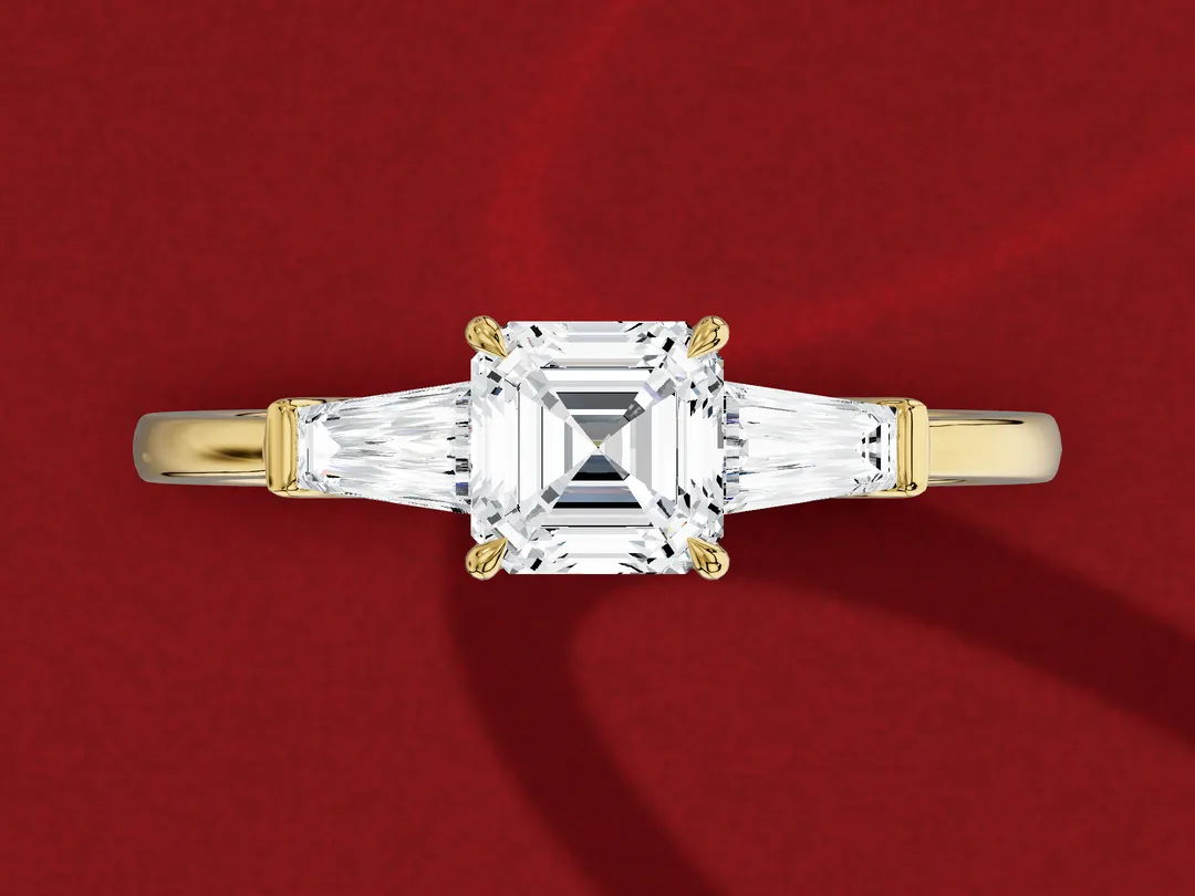 3D render from above of an asscher-cut diamond with a tapered baguette on each side, each wider beside the centre stone.