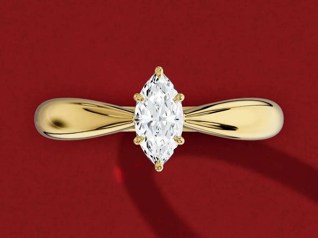 3D render from above of a yellow gold marquise solitaire whose band narrows as it reaches the stone.