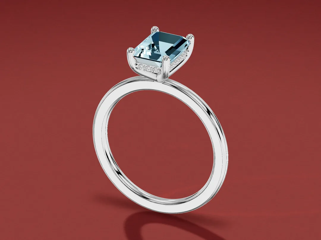 3D render of an emerald-cut pale blue aquamarine solitaire ring in white gold, with small diamonds set beneath the stone.