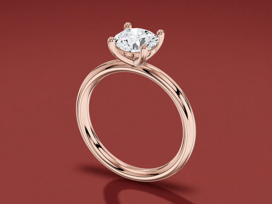 3D render of a four-claw round diamond solitaire ring in rose gold, standing on a burgundy table.