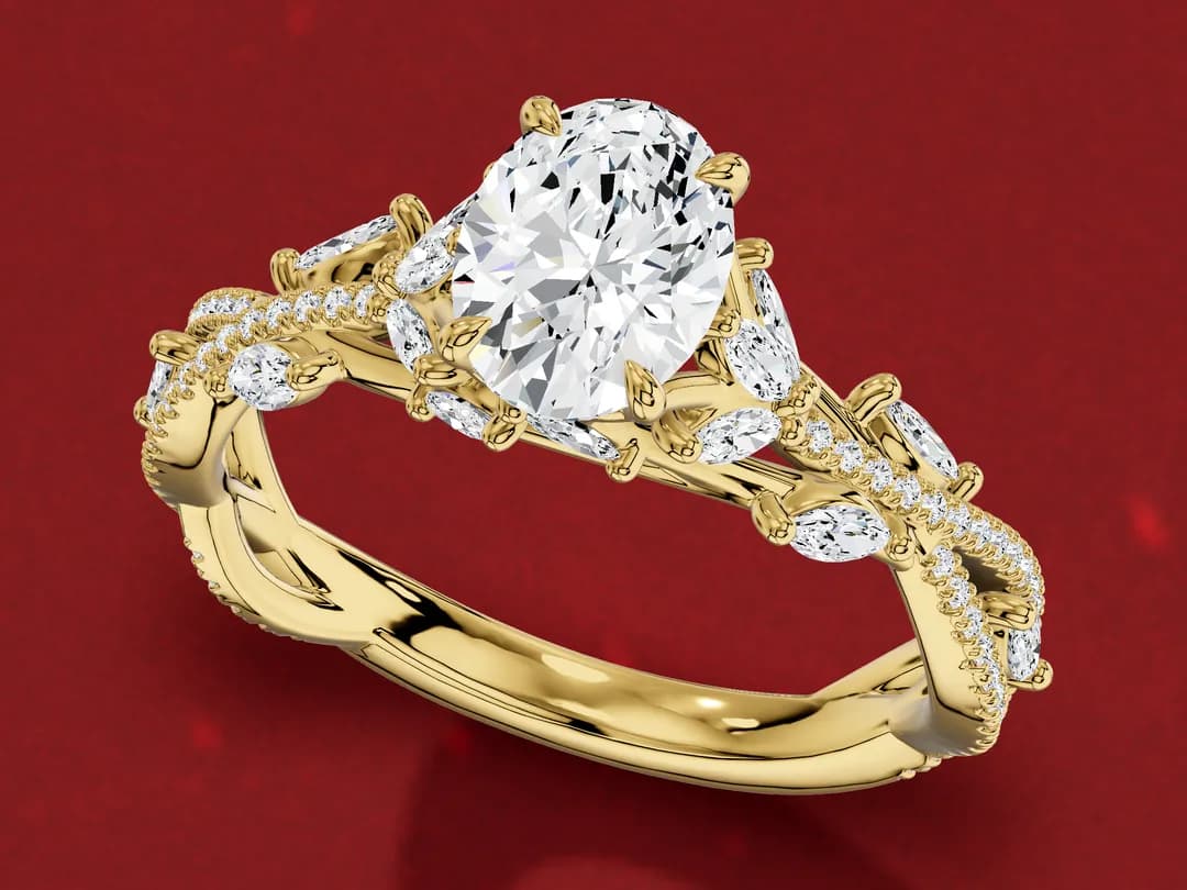 3D render of a yellow gold oval diamond ring whose twisting band carries small marquise diamonds set like leaves along a vine.