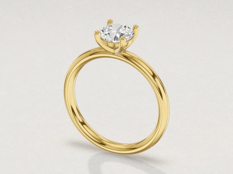 3D render of a yellow gold solitaire engagement ring with a 1 carat round diamond held by four prongs