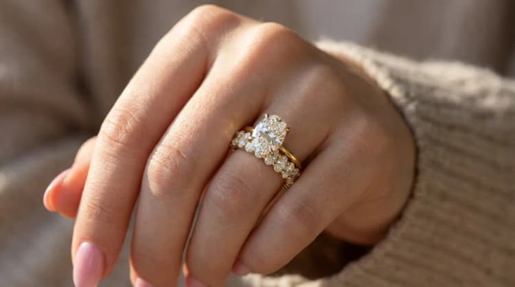 Oval solitaire engagement ring with oval eternity band stack by Lily Dia Jewellery