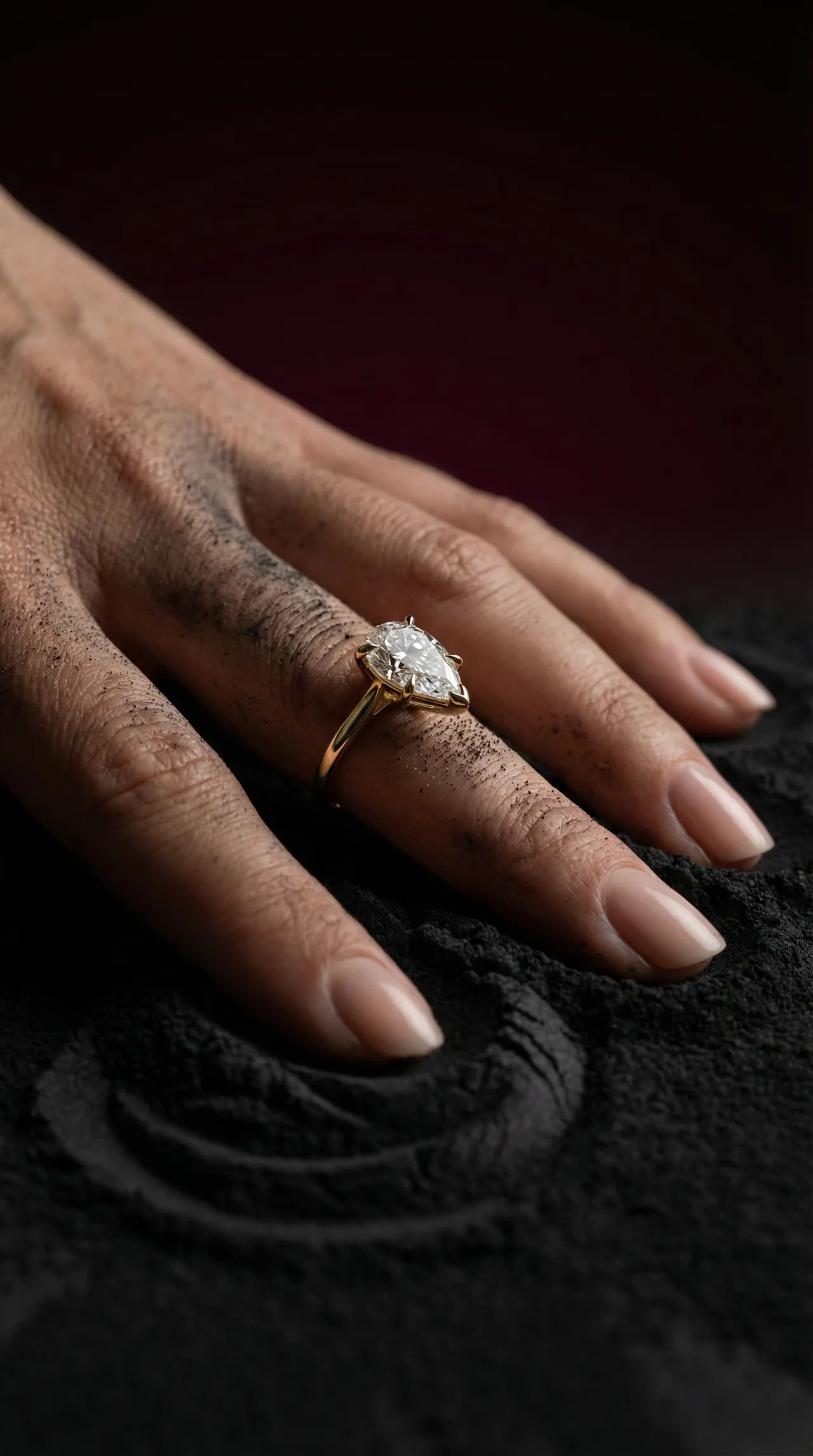 Pear cut engagement ring on long slim fingers by Lily Dia Jewellery