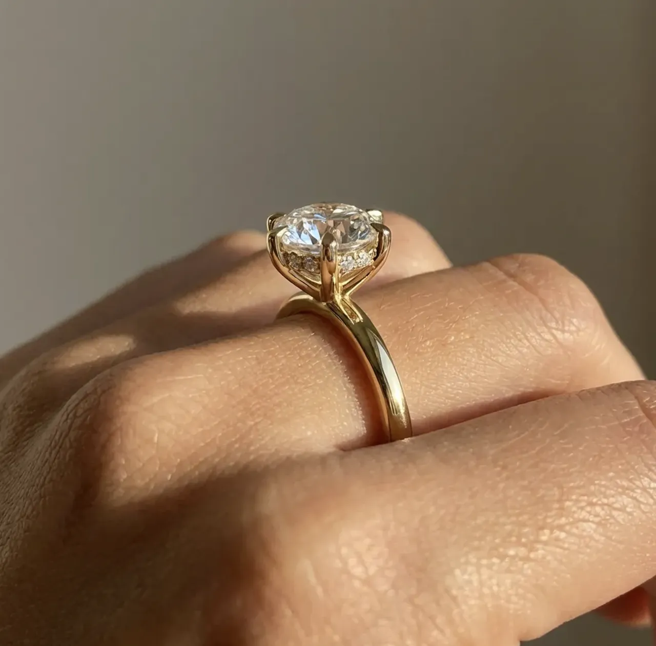 Round brilliant solitaire engagement ring profile in yellow gold by Lily Dia Jewellery