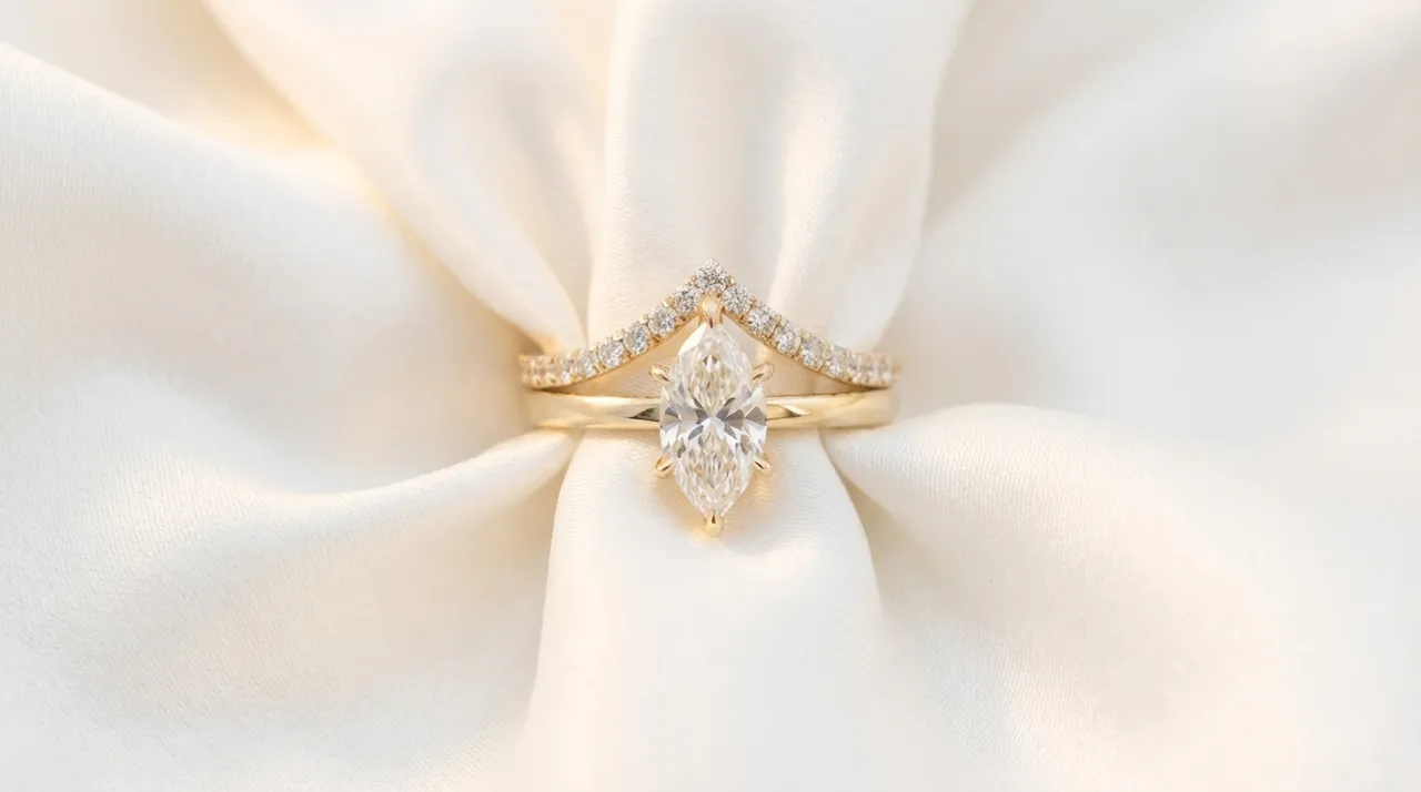 Curved diamond wedding band sitting flush against a marquise engagement ring by Lily Dia Jewellery