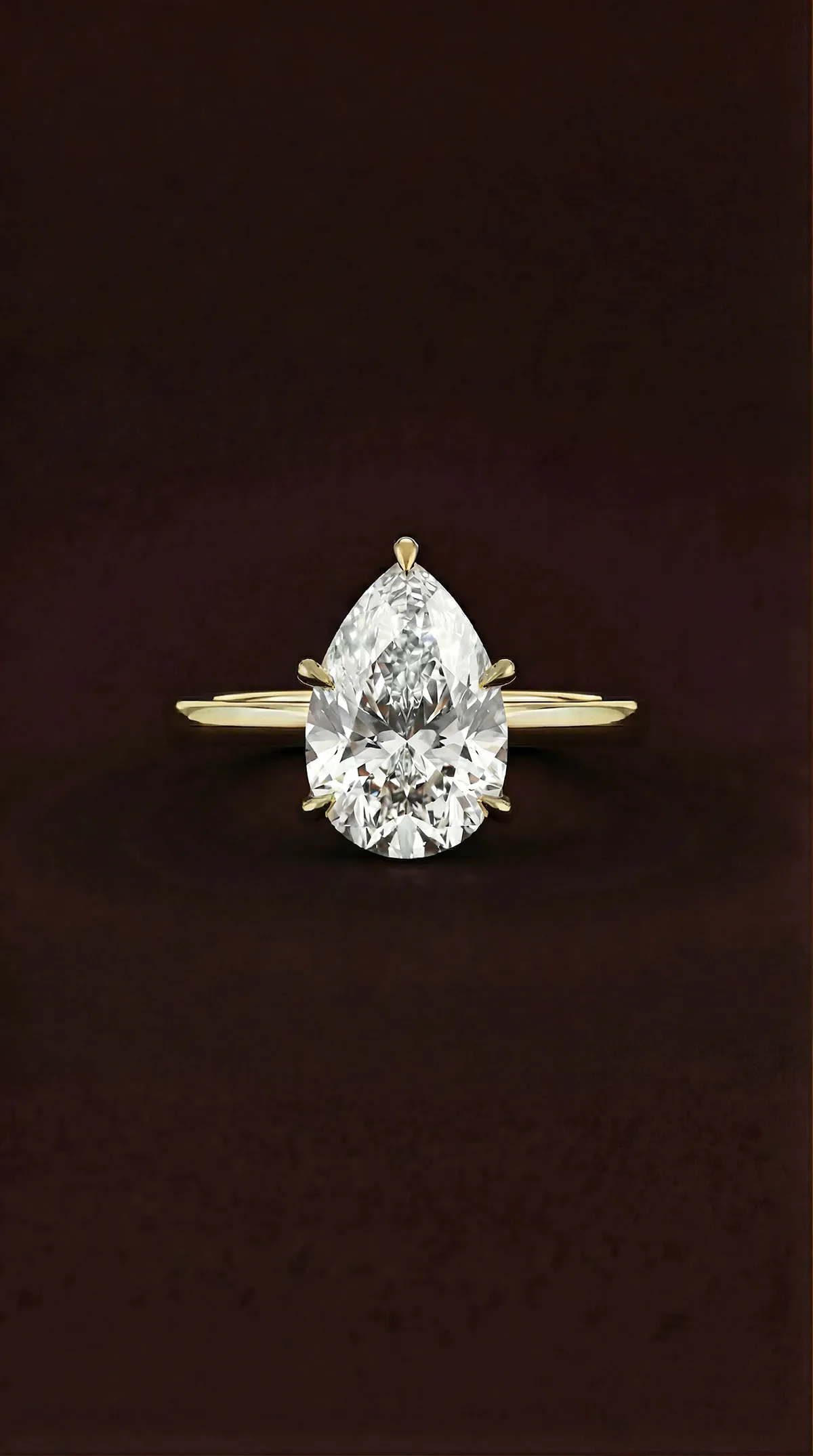 Pear shaped lab-grown diamond solitaire engagement ring with five claws in yellow gold, by Lily Dia Jewellery